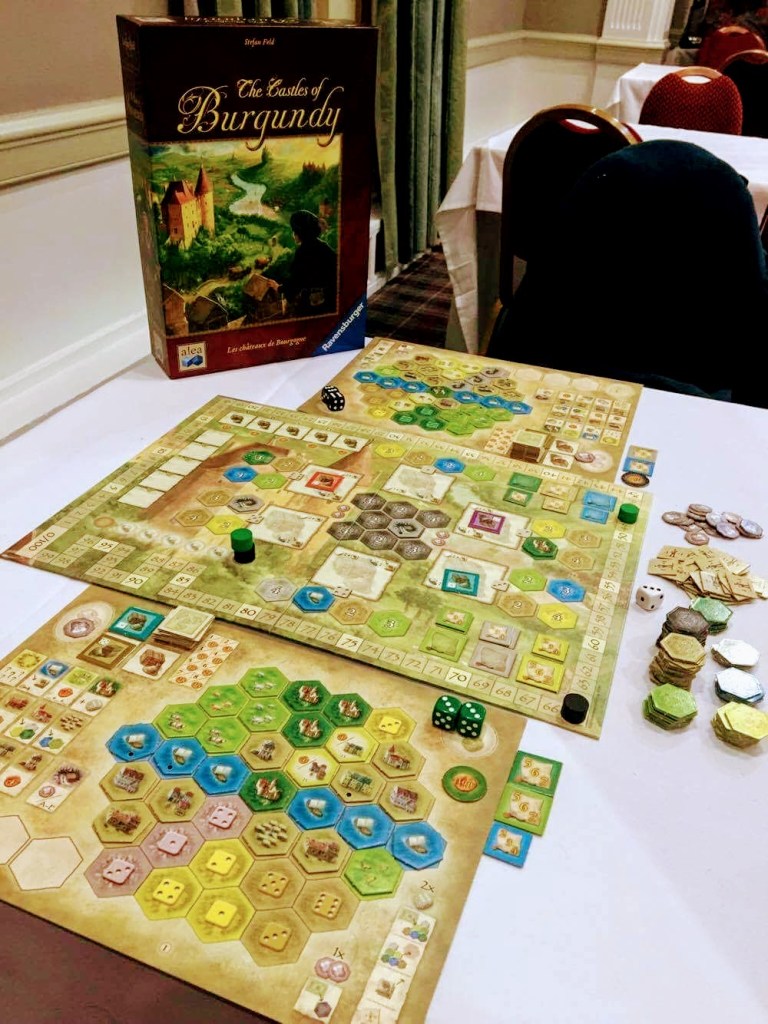 A photo of the box and board of Castles of Burgundy.