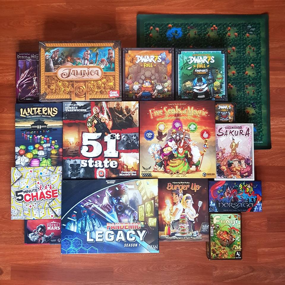 A selection of games that I bought at the UK Games Expo 2018. It Includes: Pandemic Legacy S1, Burger Up, Fungi. Pocket Mars, 5 Minute Chase, Norsaga, Lanterns, 51st State, 5 Seals of Magic, Sakura, Draco Magi, Jamaica and a Dwar7s Fall collection.